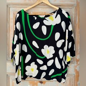 Gorman crepe top that packs a punch! Green, cream, yellow flowers on black. L.
